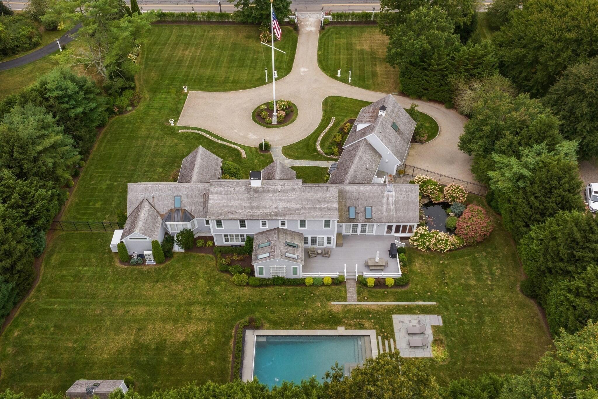 1460 South County Road Osterville, MA 02655 - Photo 2 of 25 an aerial view of a house with garden space and swimming pool