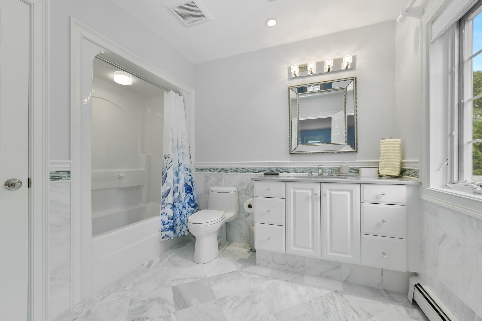 1460 South County Road Osterville, MA 02655 - Photo 22 of 25 a bathroom with a sink toilet and shower