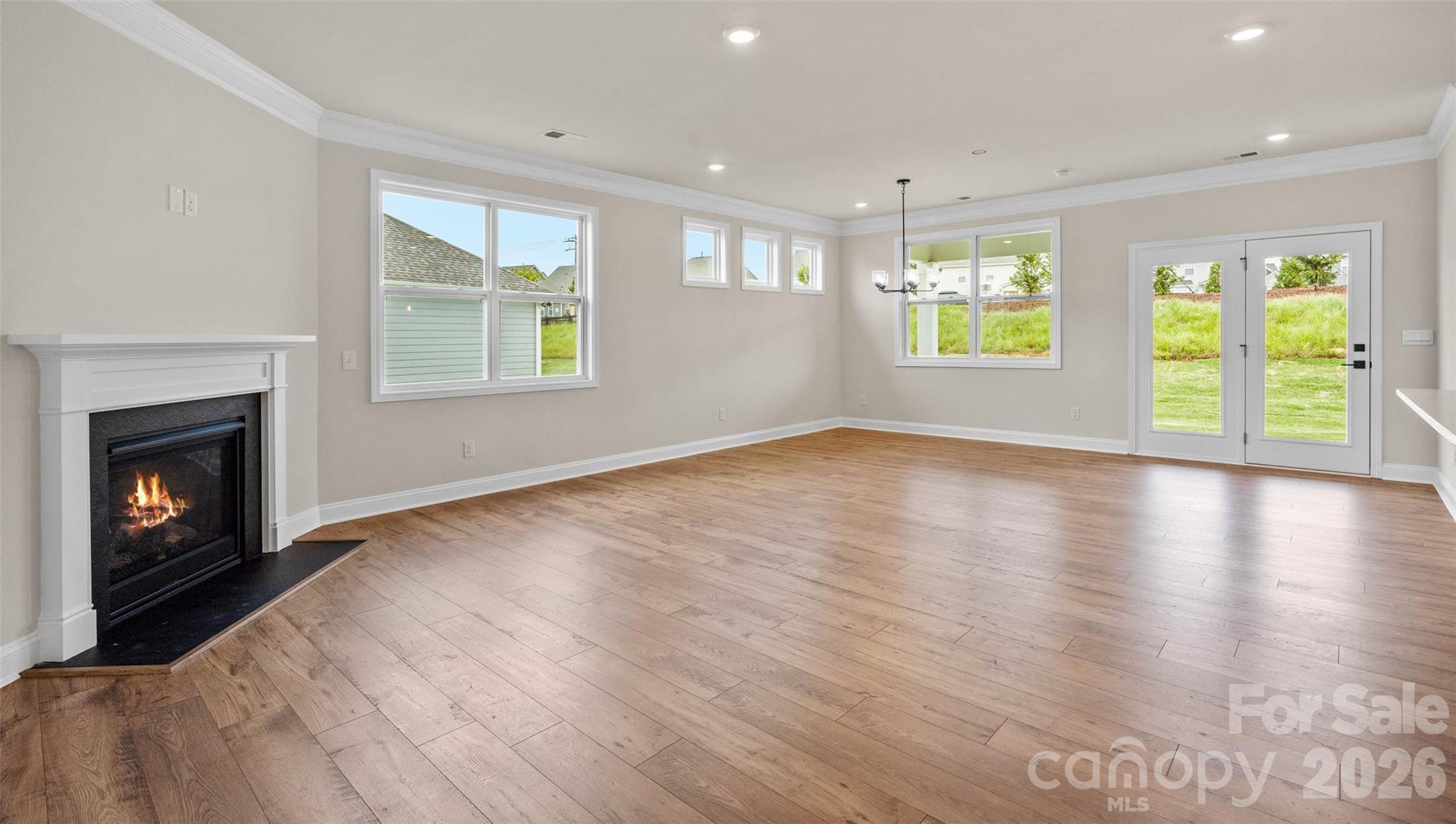 662 River Btm Road Fletcher, NC 28732 - Photo 11 of 31 a view of an empty room with a window and wooden floor