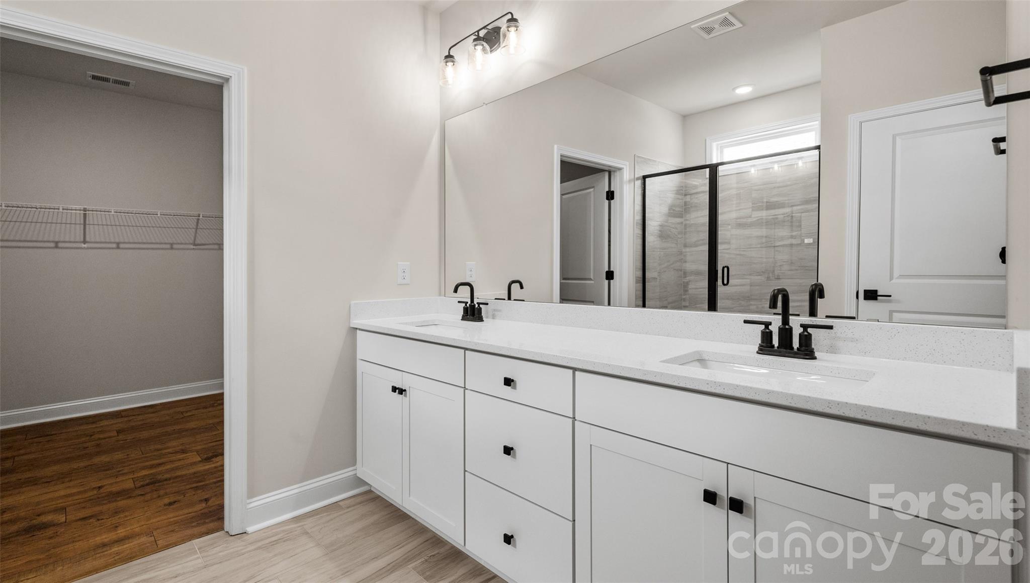 662 River Btm Road Fletcher, NC 28732 - Photo 22 of 31 a bathroom with double vanity sink and a mirror