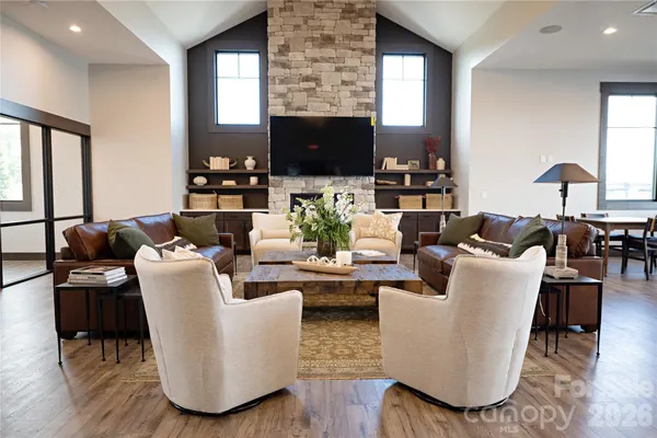a living room with fireplace furniture and a flat screen tv