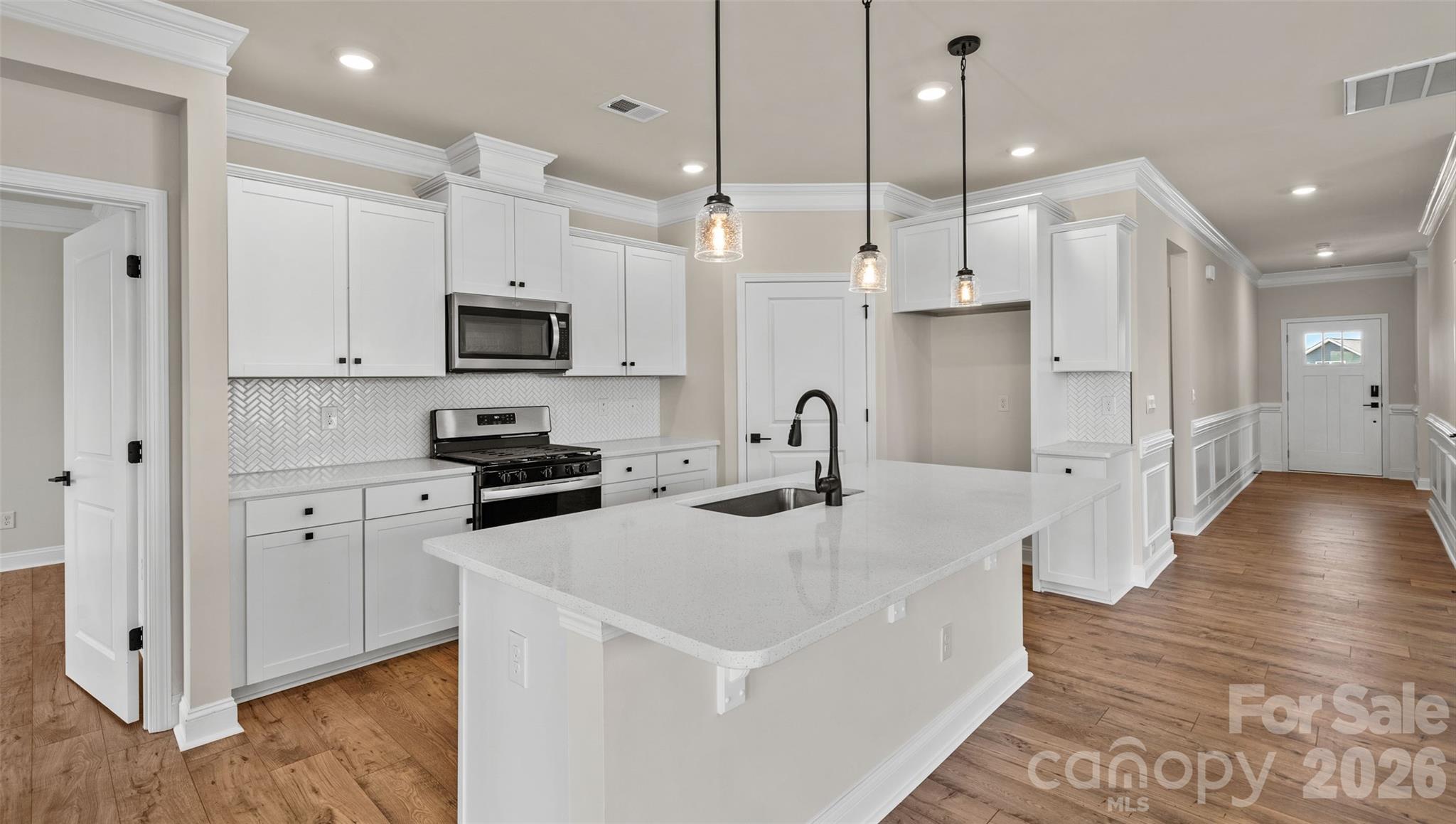 662 River Btm Road Fletcher, NC 28732 - Photo 6 of 31 a kitchen with stainless steel appliances granite countertop a refrigerator a sink a stove and a wooden floors