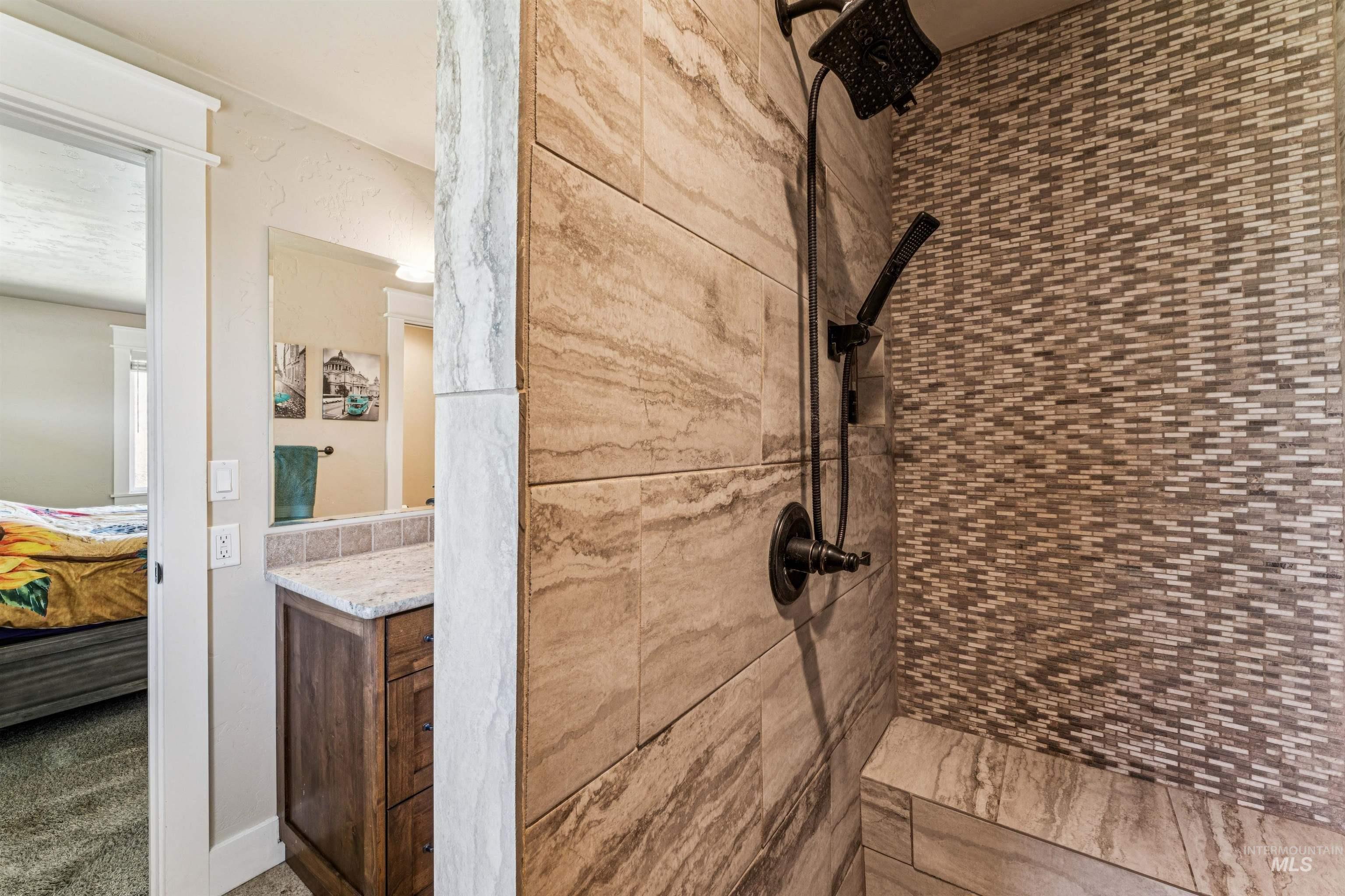 1050 West South Slope Road Emmett, ID 83617 - Photo 18 of 49 Bathroom with vanity, a shower stall, and ensuite bathroom