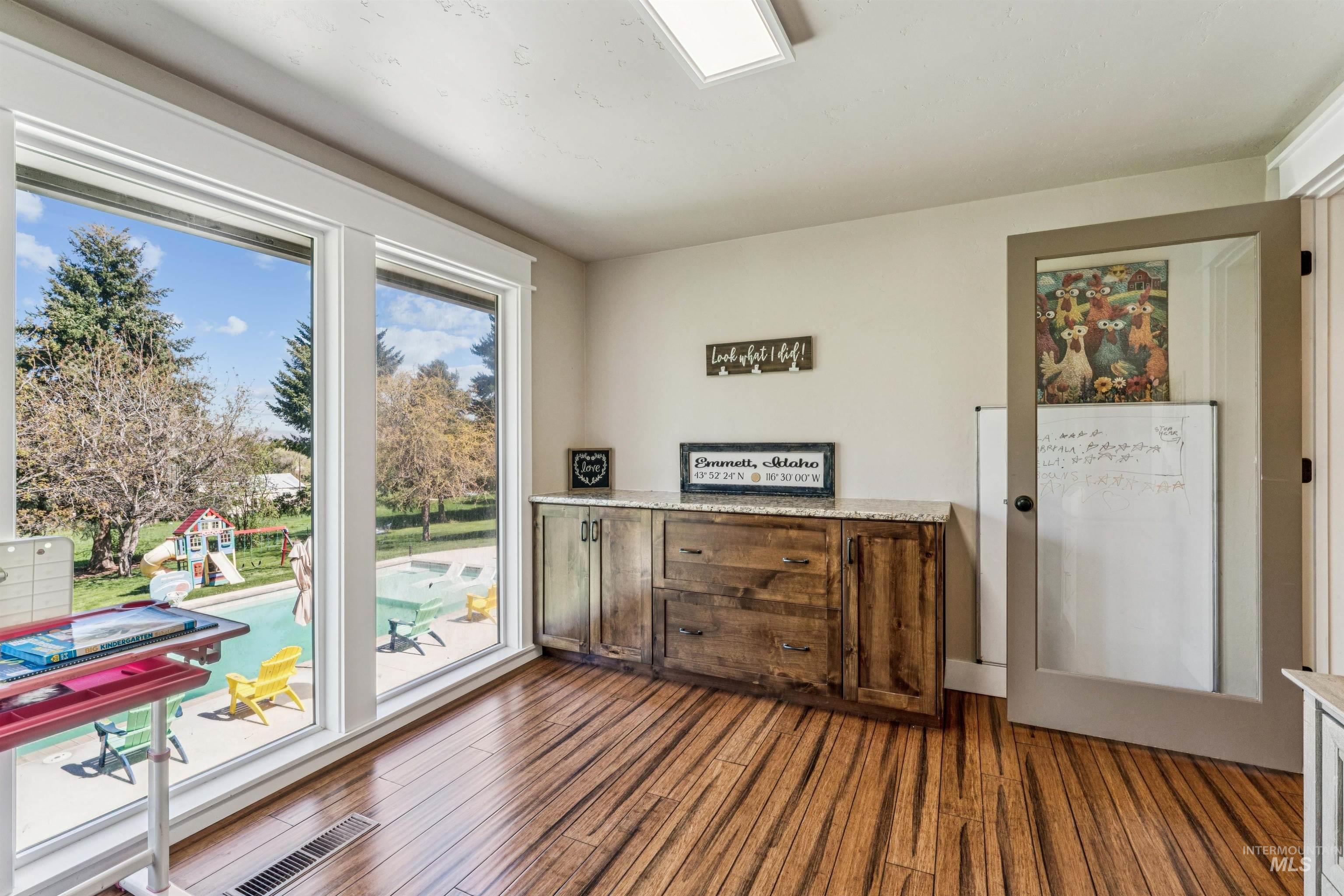 1050 West South Slope Road Emmett, ID 83617 - Photo 21 of 49 Doorway to outside featuring wood finished floors