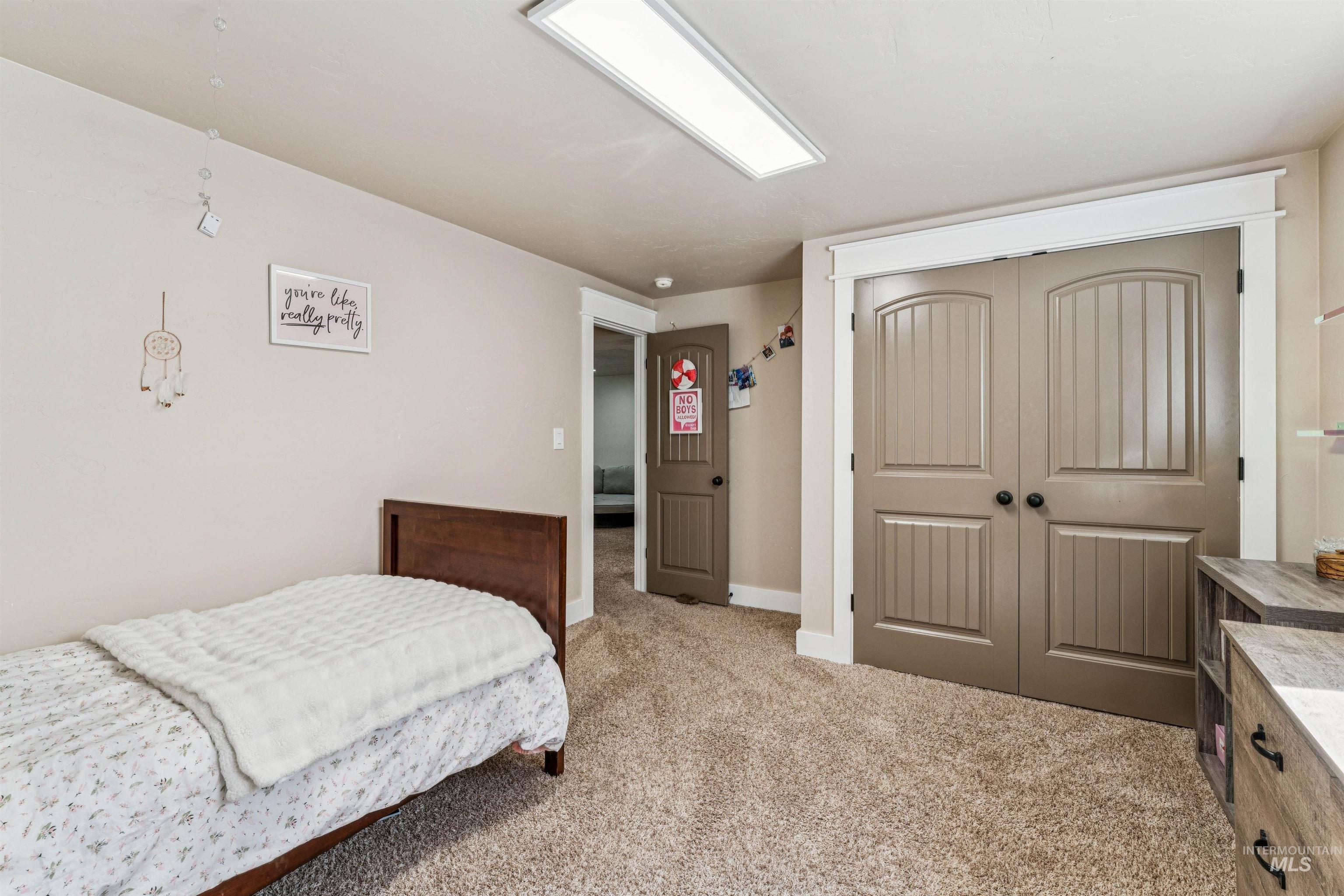 1050 West South Slope Road Emmett, ID 83617 - Photo 25 of 49 Bedroom featuring a closet and light colored carpet