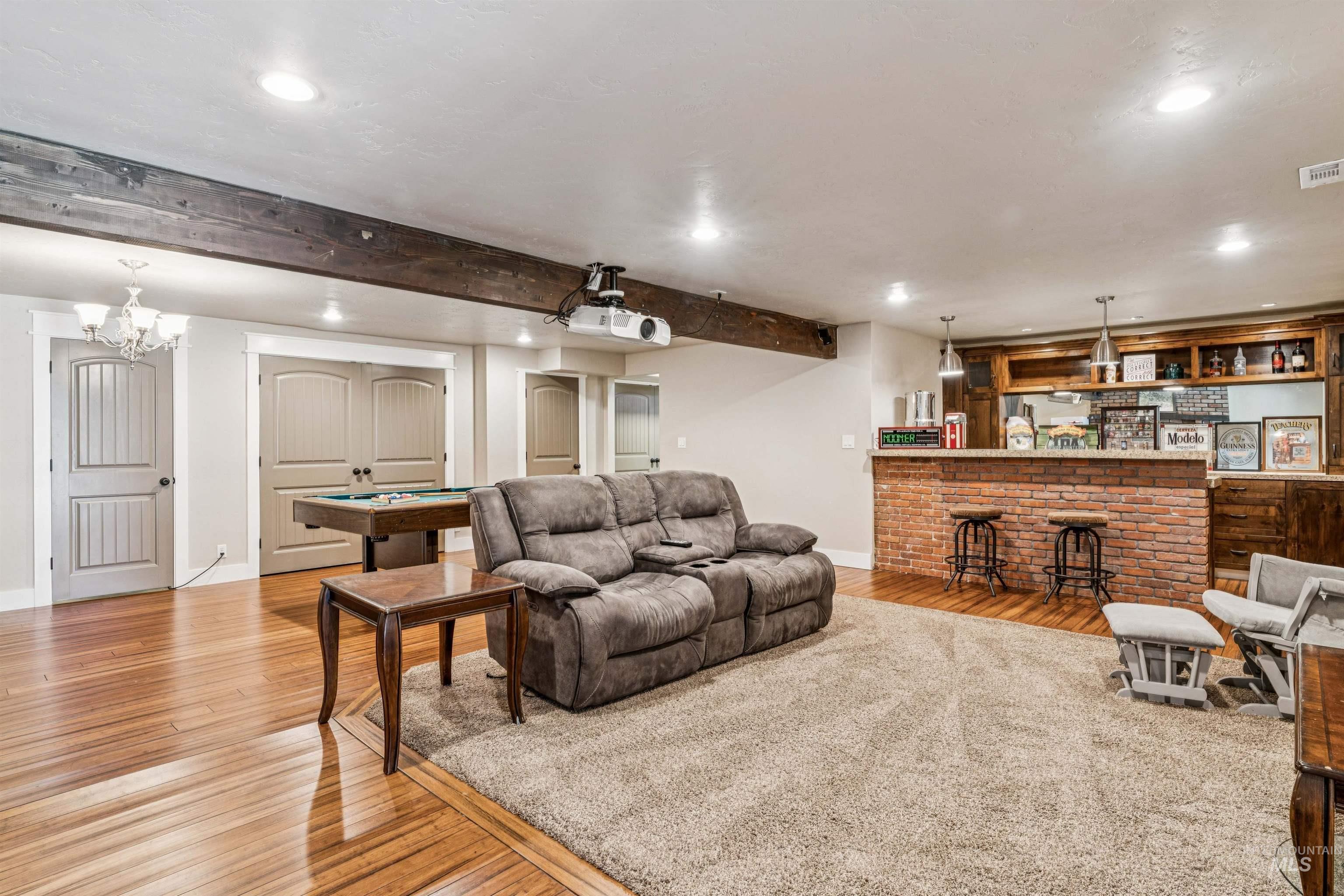 1050 West South Slope Road Emmett, ID 83617 - Photo 30 of 49 Living area with light wood-style floors, recessed lighting, billiards table, beam ceiling, and bar area