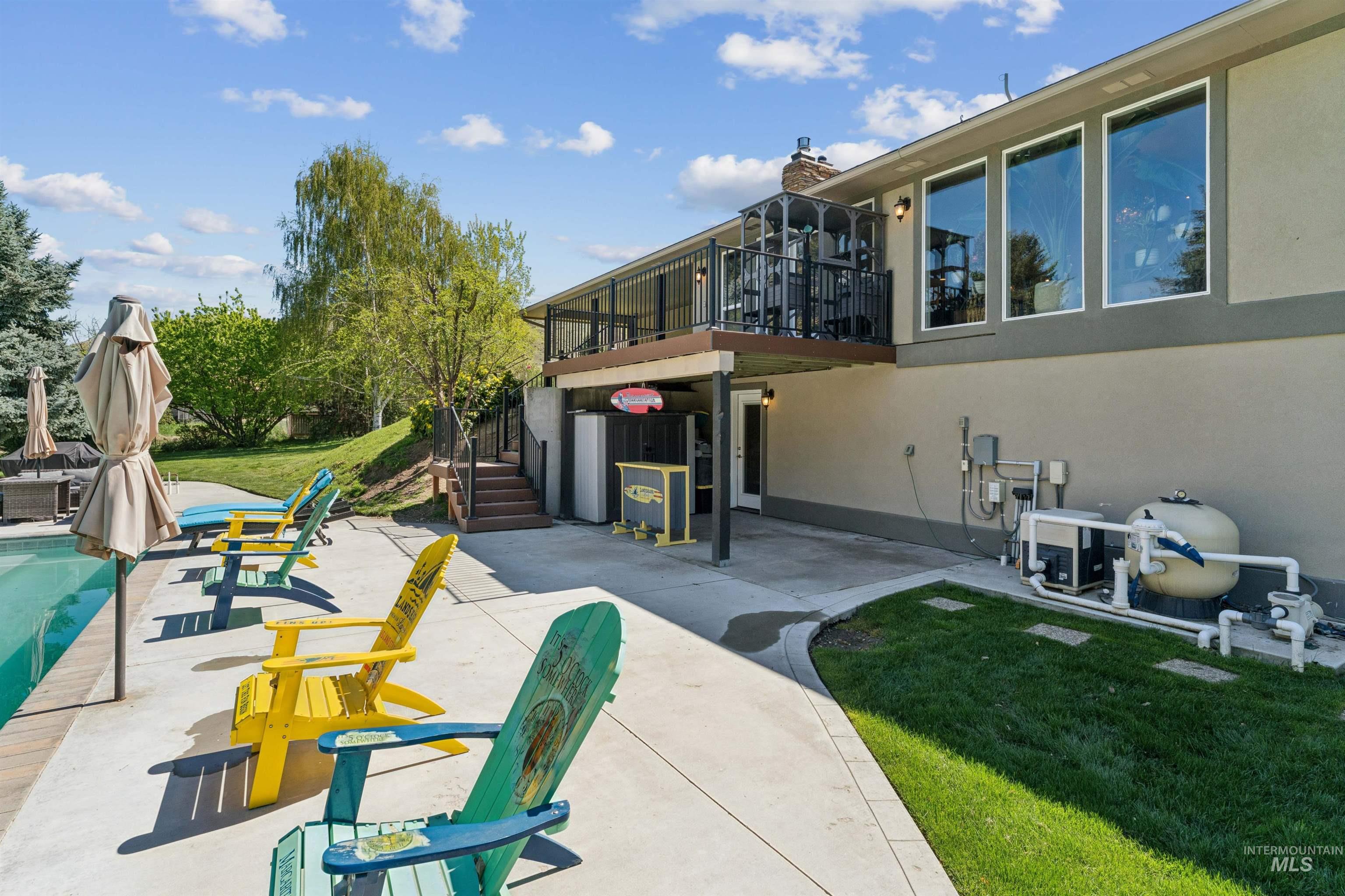 1050 West South Slope Road Emmett, ID 83617 - Photo 40 of 49 View of patio / terrace with an outdoor pool and a wooden deck