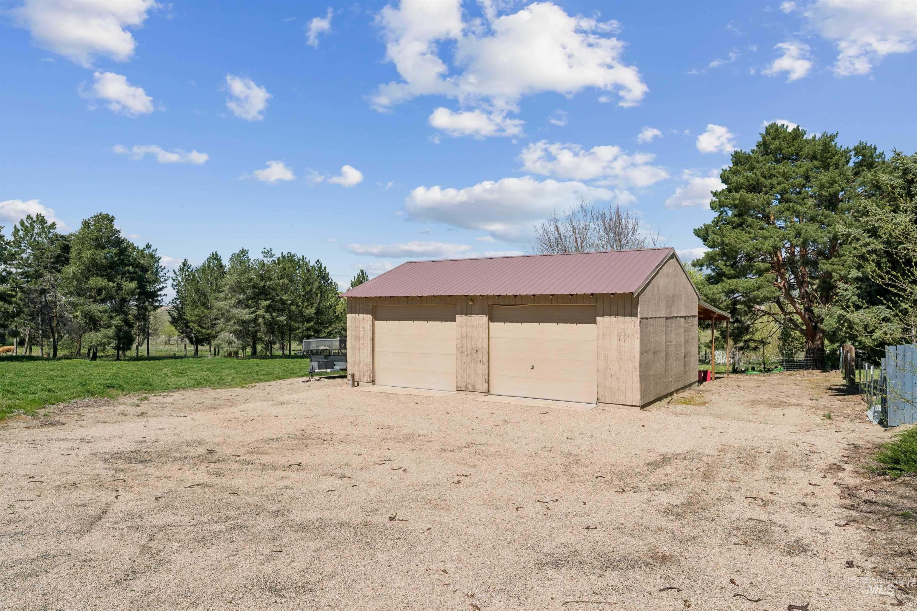 1050 West South Slope Road Emmett, ID 83617 - Photo 42 of 49 Detached garage featuring view of scattered trees