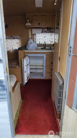 a view of a kitchen with appliances and cabinets