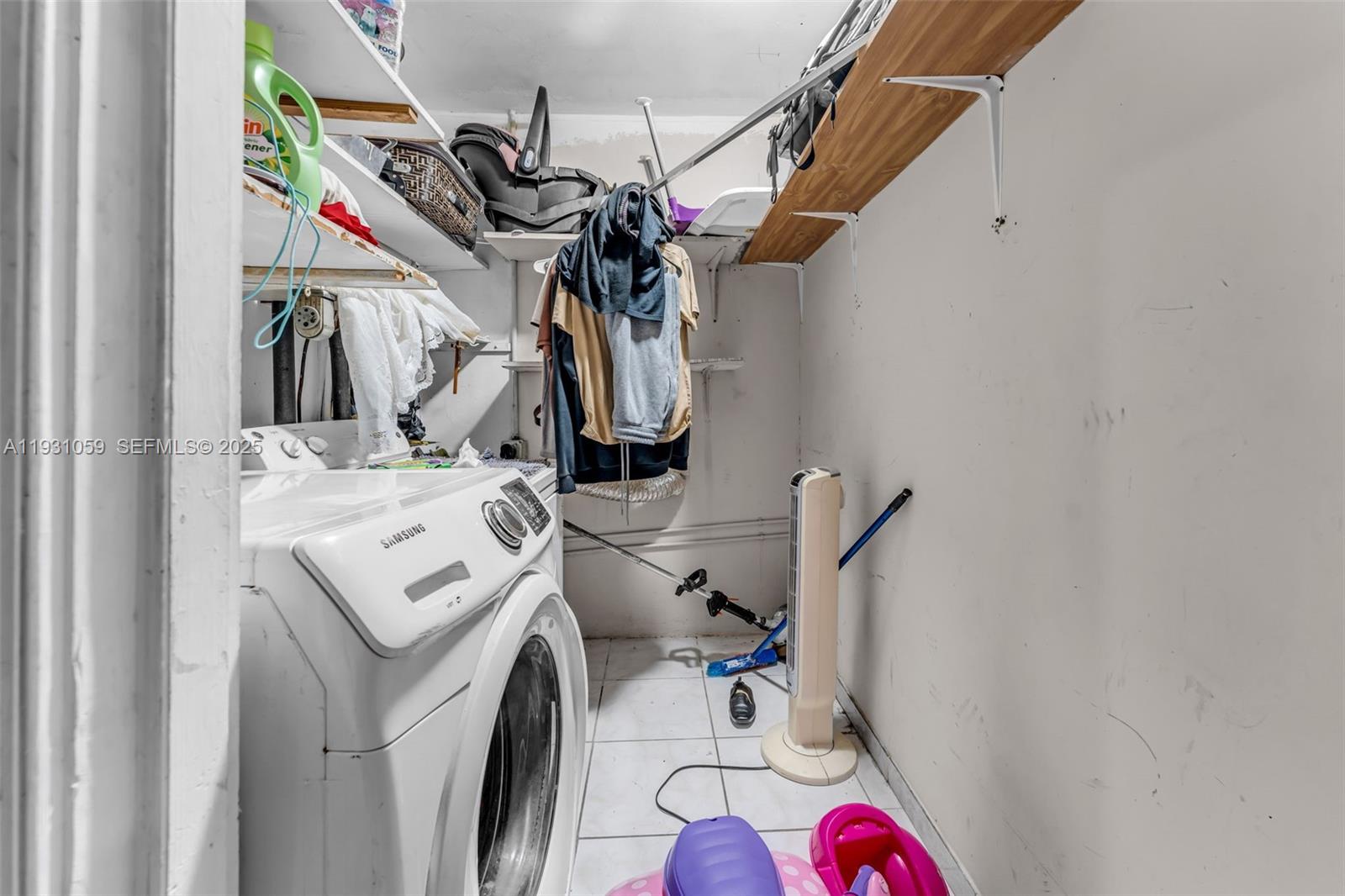 445 Northwest 8th Street Homestead, FL 33030 - Photo 14 of 32 a utility room with dryer washer and a view of bathroom