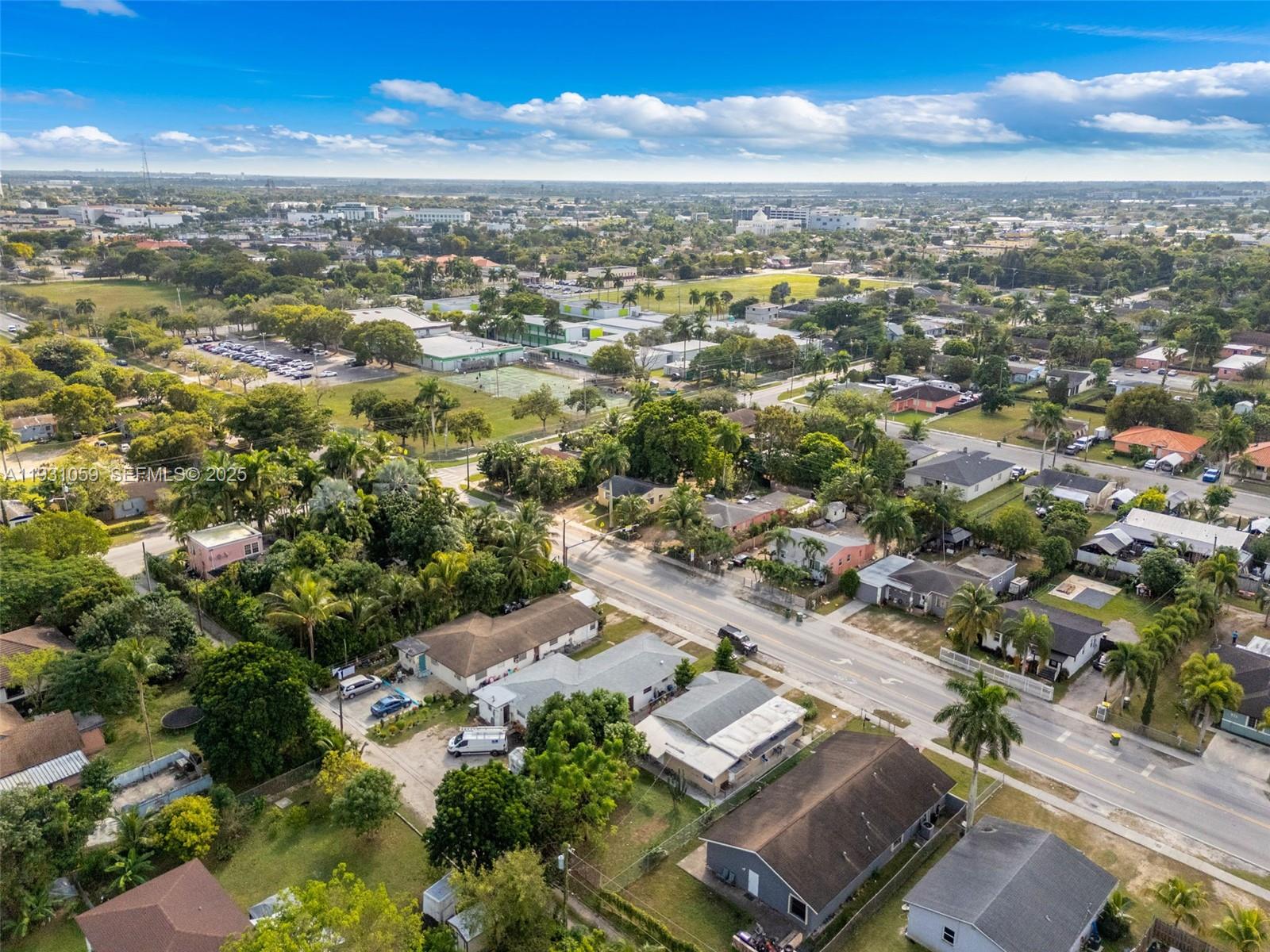 445 Northwest 8th Street Homestead, FL 33030 - Photo 30 of 32 an aerial view of residential houses with outdoor space