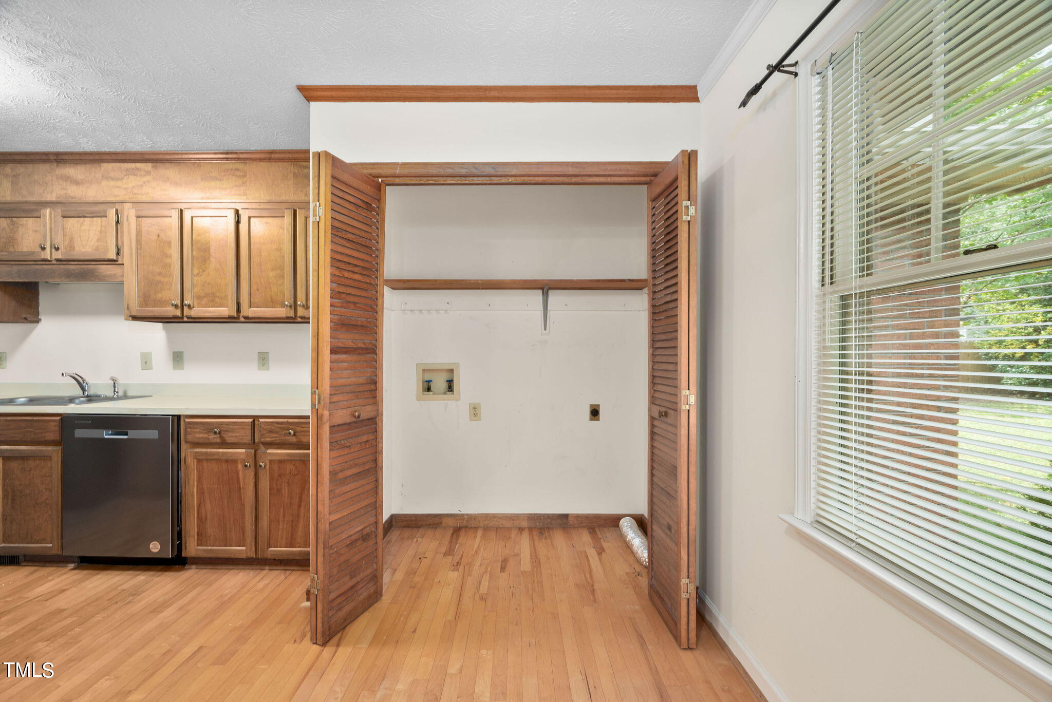 145 Fox Run Road Pinehurst, NC 28374 - Photo 8 of 32 a view of a kitchen with wooden floor and cabinets
