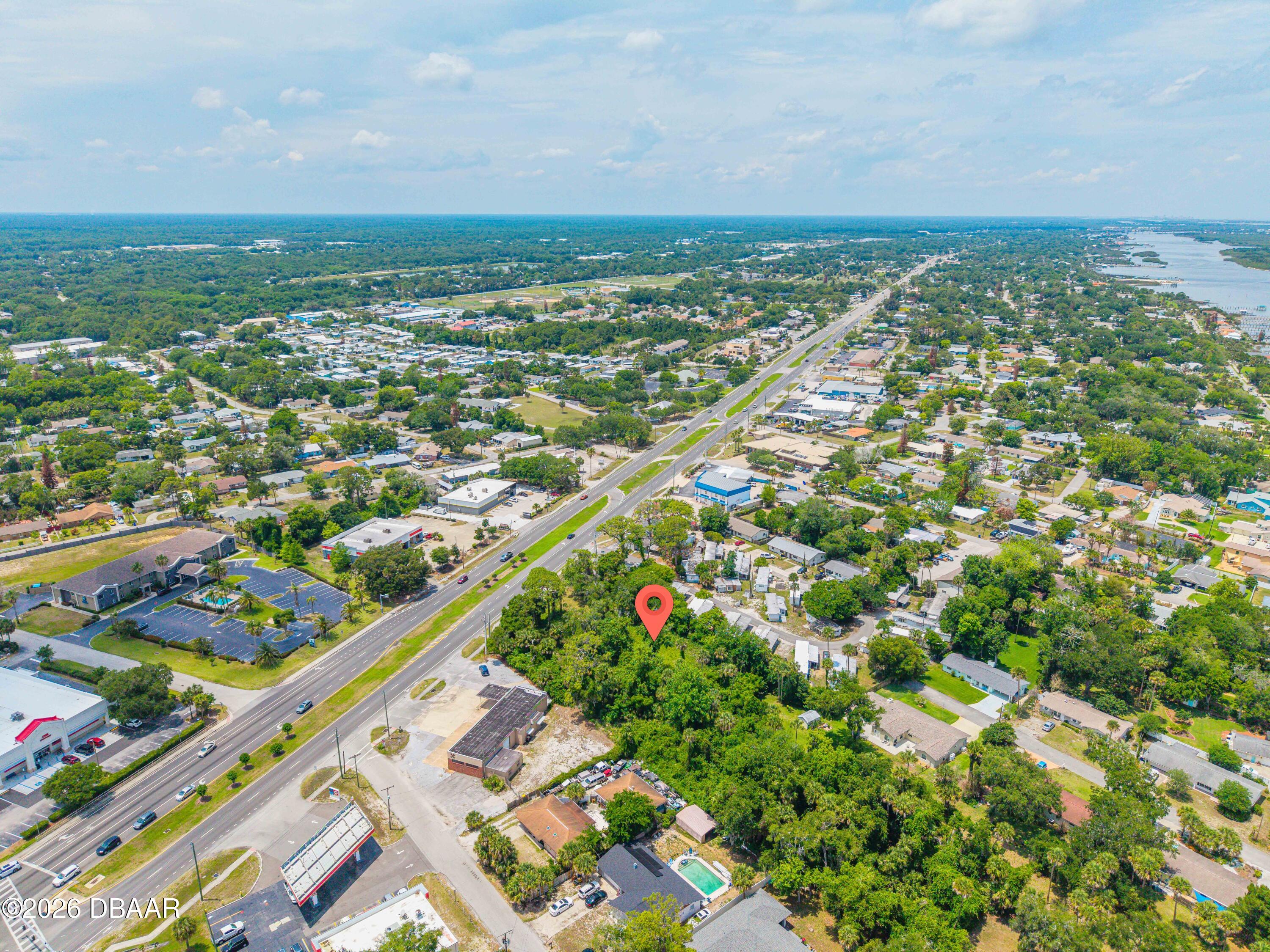 1711 South Ridgewood Avenue Edgewater, FL 32132 - Photo 9 of 10 an aerial view of residential houses with outdoor space