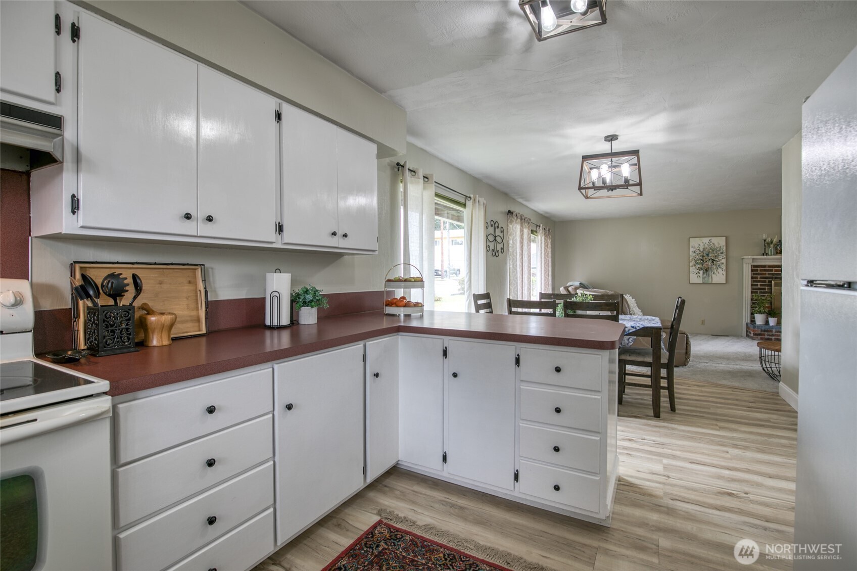 218 Holly Lane Cosmopolis, WA 98537 - Photo 13 of 30 a kitchen with cabinets appliances and a wooden floor