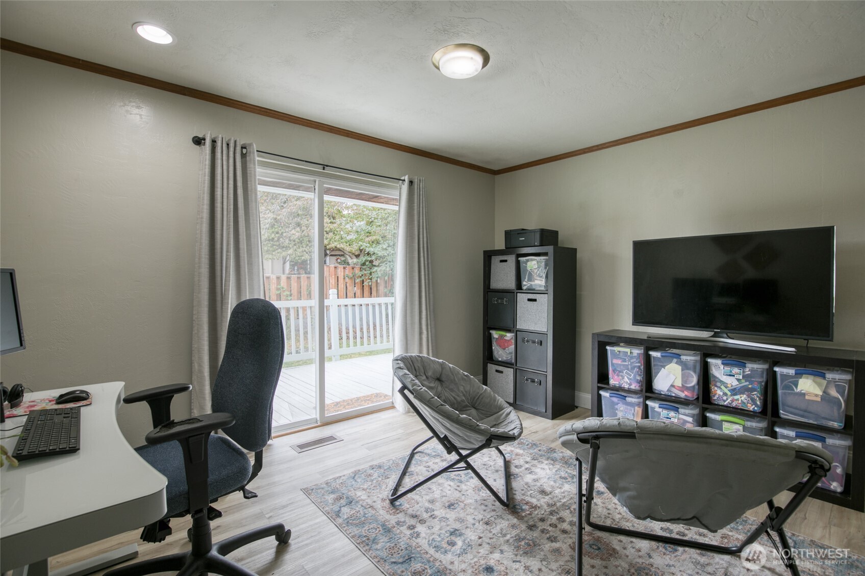 218 Holly Lane Cosmopolis, WA 98537 - Photo 16 of 30 a work room with furniture and a flat screen tv