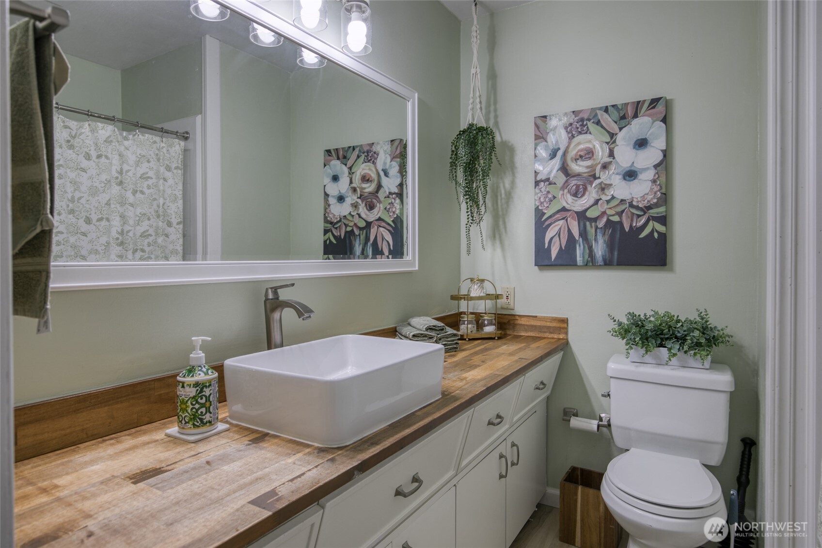 218 Holly Lane Cosmopolis, WA 98537 - Photo 22 of 30 a bathroom with a granite countertop sink a toilet and a mirror
