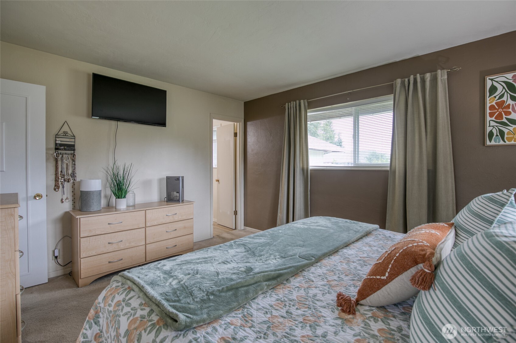 218 Holly Lane Cosmopolis, WA 98537 - Photo 26 of 30 a bedroom with a bed and a flat screen tv