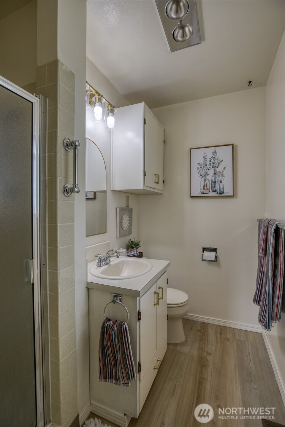 218 Holly Lane Cosmopolis, WA 98537 - Photo 27 of 30 a bathroom with a sink a toilet and a mirror