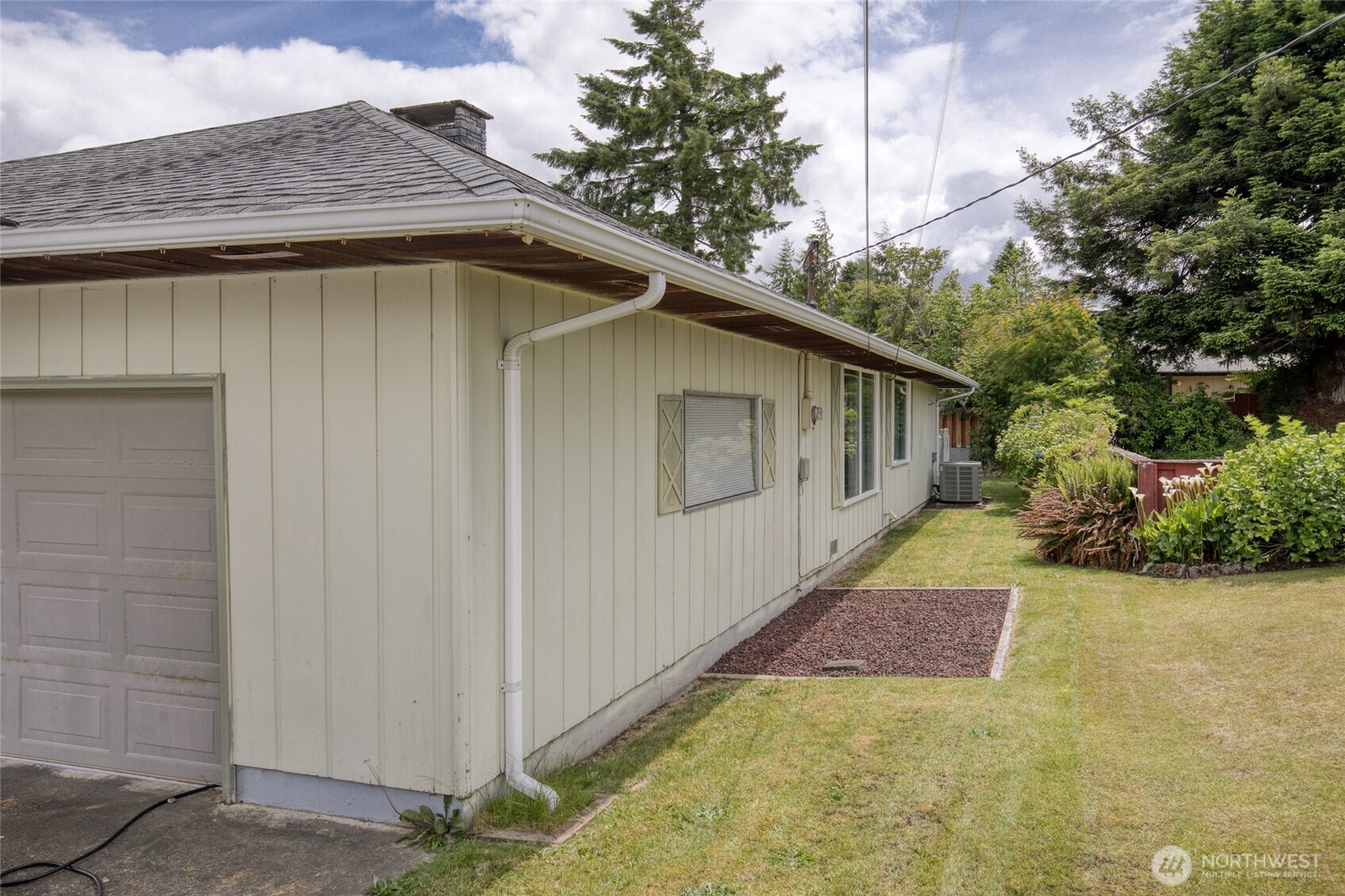 218 Holly Lane Cosmopolis, WA 98537 - Photo 5 of 30 a house with trees in the background