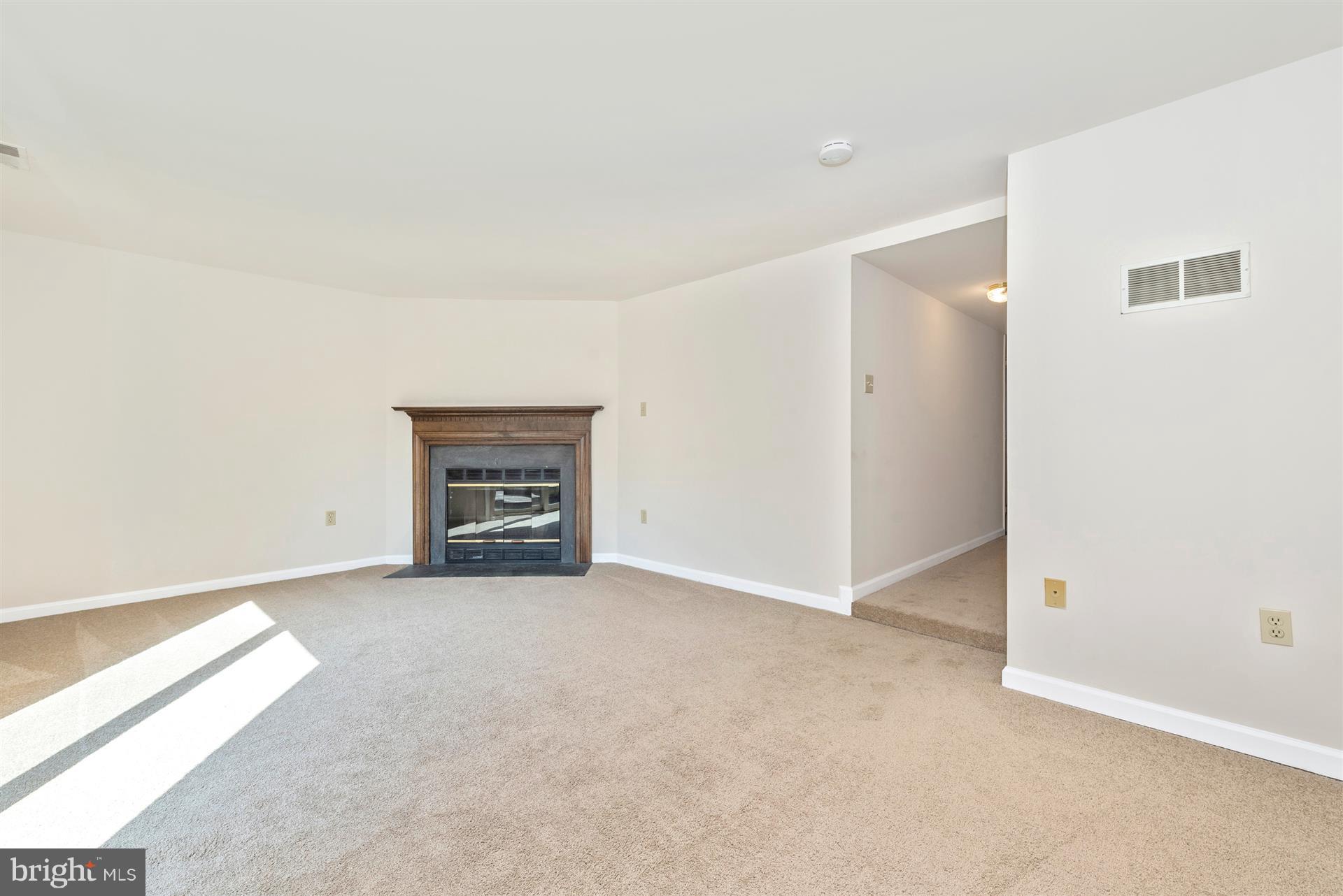 8023 Broken Reed Court Frederick, MD 21701 - Photo 4 of 25 Large family room w/cozy wood burning fireplace.