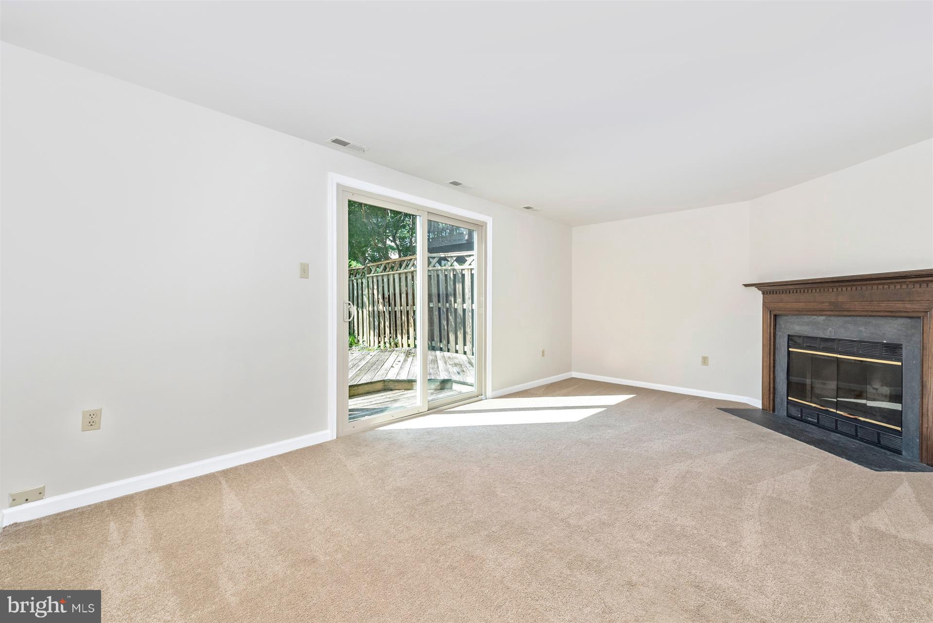 8023 Broken Reed Court Frederick, MD 21701 - Photo 5 of 25 Glass sliding doors lead you outside to backyard.