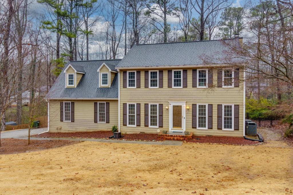 front view of a house with a yard