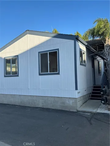 a front view of a house with stairs