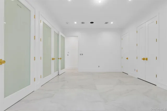 a view of a house with backyard and a trees