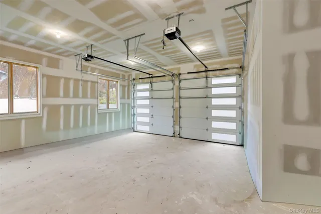 a view of a livingroom with an empty space and a window