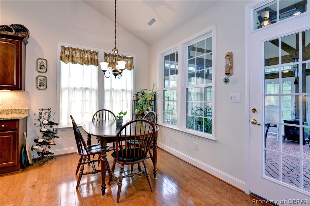 4220 Old Lock Road Williamsburg, VA 23188 - Photo 9 of 45 Light and bright, the breakfast nook offers access to the three season porch.