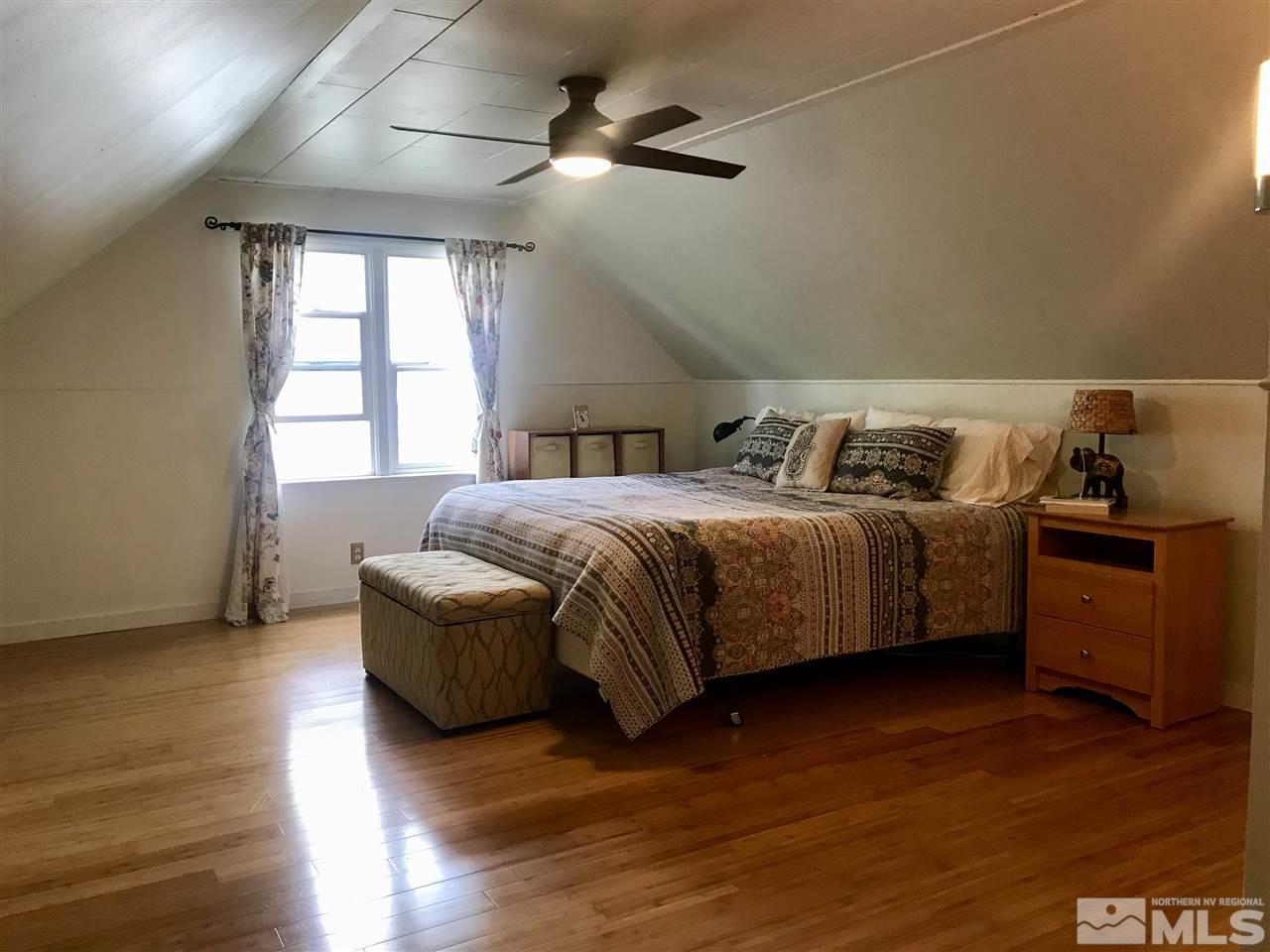 1033 University Terrace Reno, NV 89503 - Photo 13 of 22 a bedroom with a bed and a view of kitchen