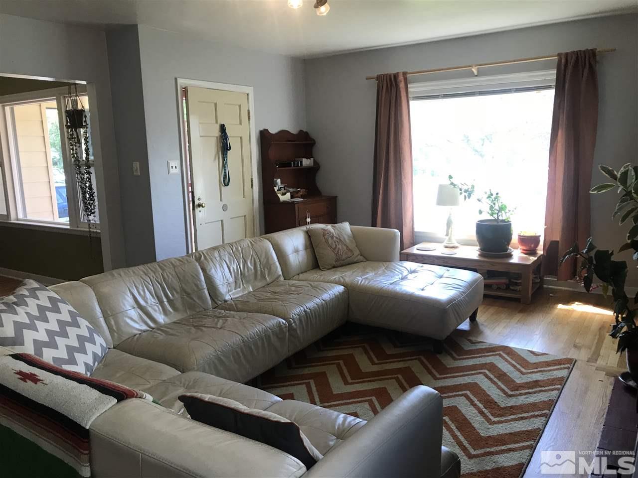 1033 University Terrace Reno, NV 89503 - Photo 4 of 22 a living room with furniture and a window