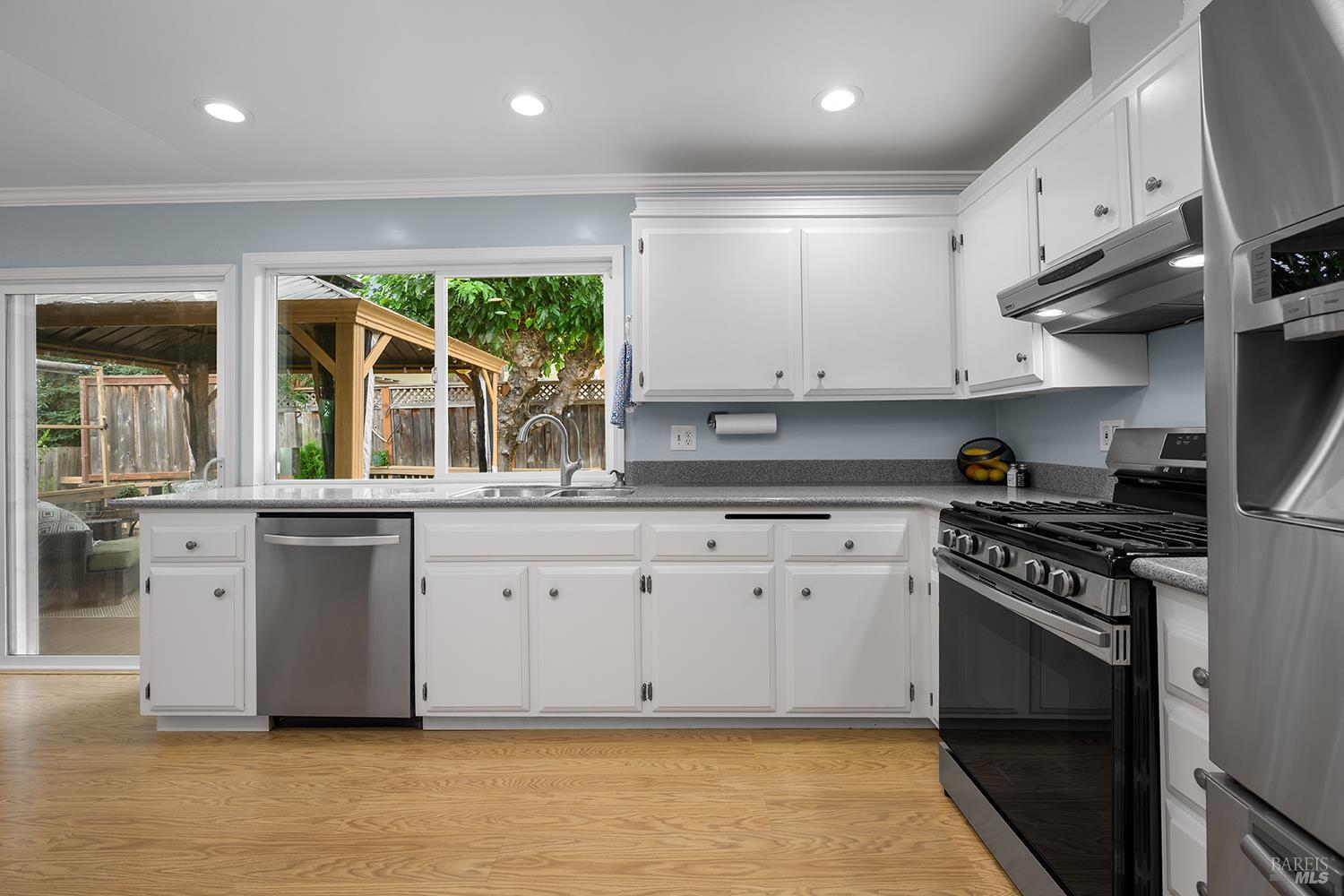 5313 Yerba Buena Road Santa Rosa, CA 95409 - Photo 10 of 34 Ample counter space, abundant cabinetry, stainless steel appliances, and a large picture window overlooking the backyard make this kitchen both functional and inviting.