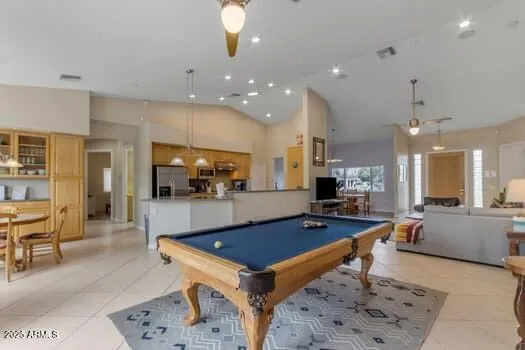 a living room with furniture a large window and a table