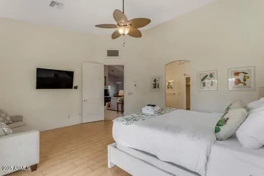 a bedroom with a bed and window