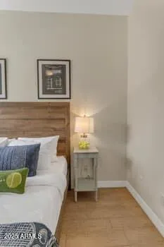 a bedroom with a bed and a television