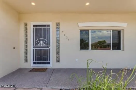 a front view of a house with a large window
