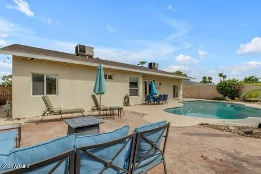 a outdoor living space with furniture and a potted plant
