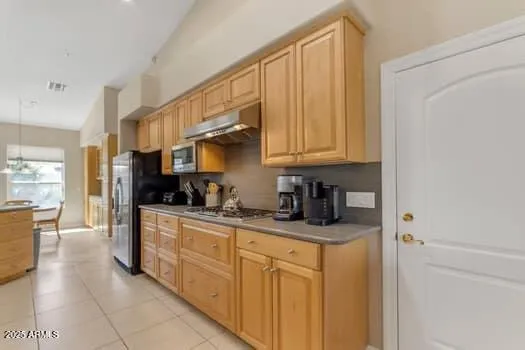 a kitchen with stainless steel appliances granite countertop a sink and cabinets