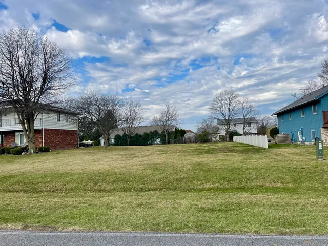 a view of a big yard with a house
