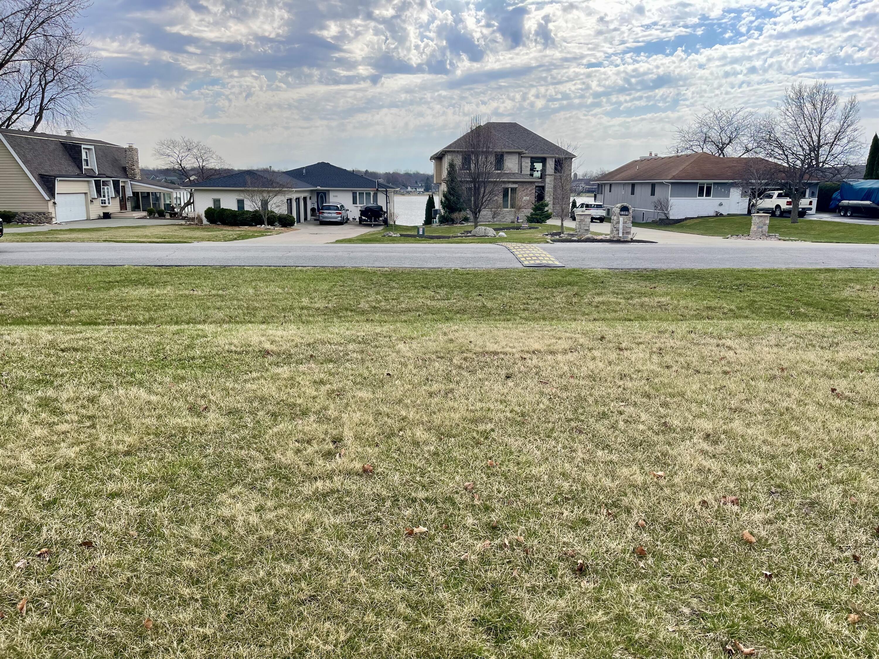 3391 West Lakeshore Drive Crown Point, IN 46307 - Photo 2 of 2 a front view of a house with a big yard