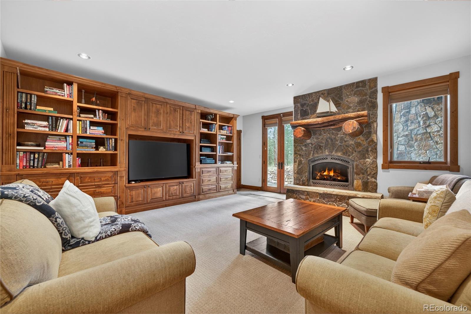 148 County Road Tabernash, CO 80478 - Photo 28 of 45 a living room with furniture a flat screen tv and a fireplace
