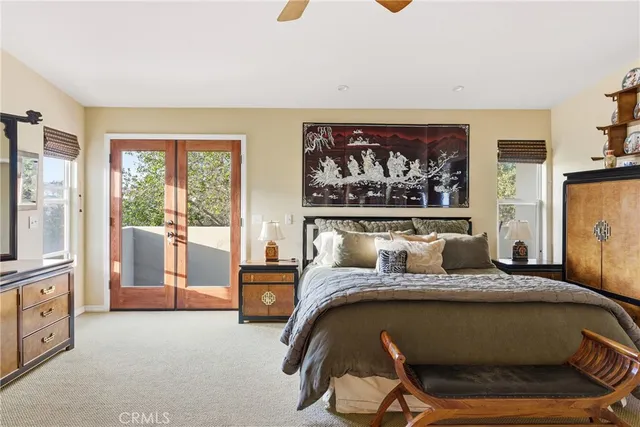 a view of a patio with couches table and chairs and potted plants