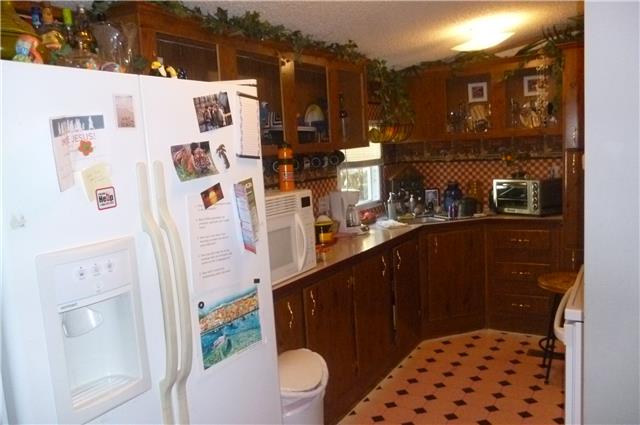 6908 Primm Springs Road Lyles, TN 37098 - Photo 11 of 19 Kitchen, updated appliances. All kitchen appliances remain as well as washer/dryer.