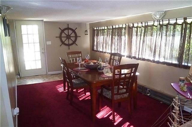 6908 Primm Springs Road Lyles, TN 37098 - Photo 9 of 19 Sun room, currently used as dining area, great view to back yard and woods.