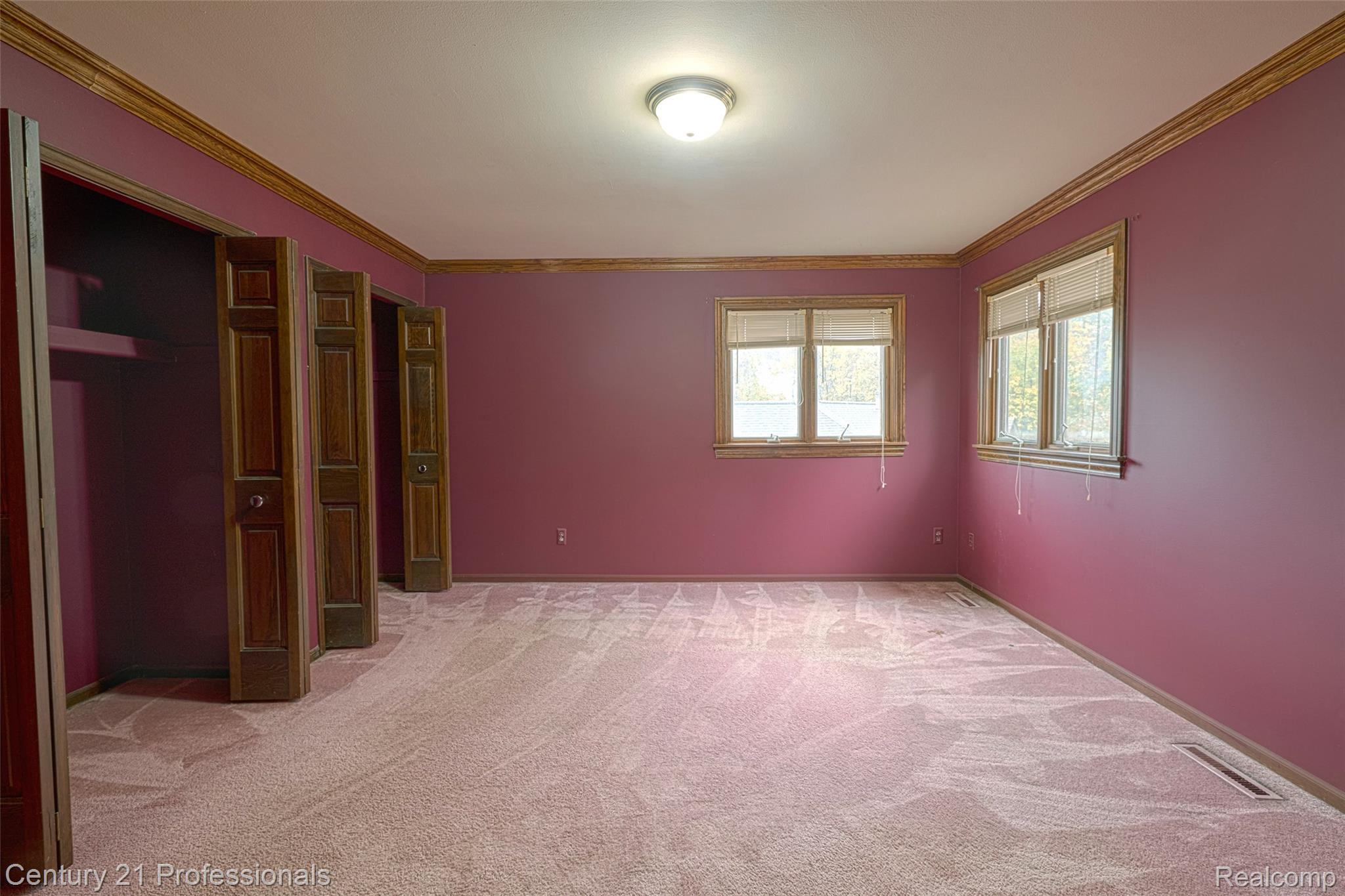 303 East Snell Road Rochester, MI 48306 - Photo 27 of 45 Bedroom with ornamental molding and full ensuite bathroom