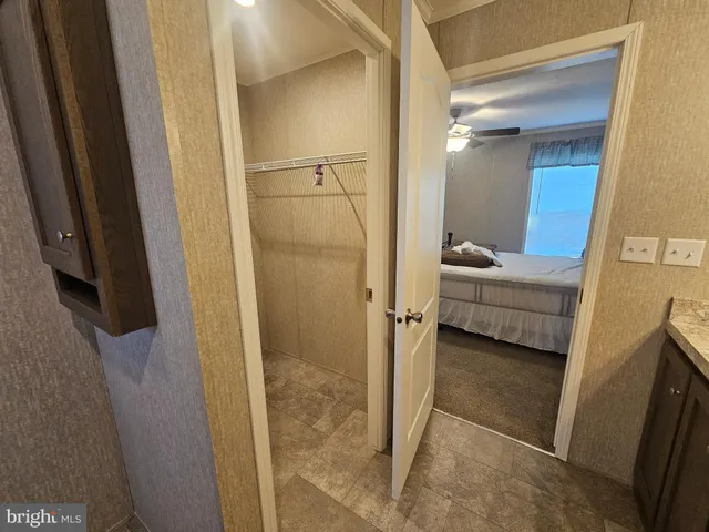 a view of living room with furniture and a gate