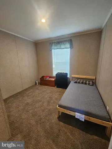 a room with a bed and a window