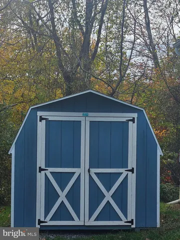 a wooden door in front of a house