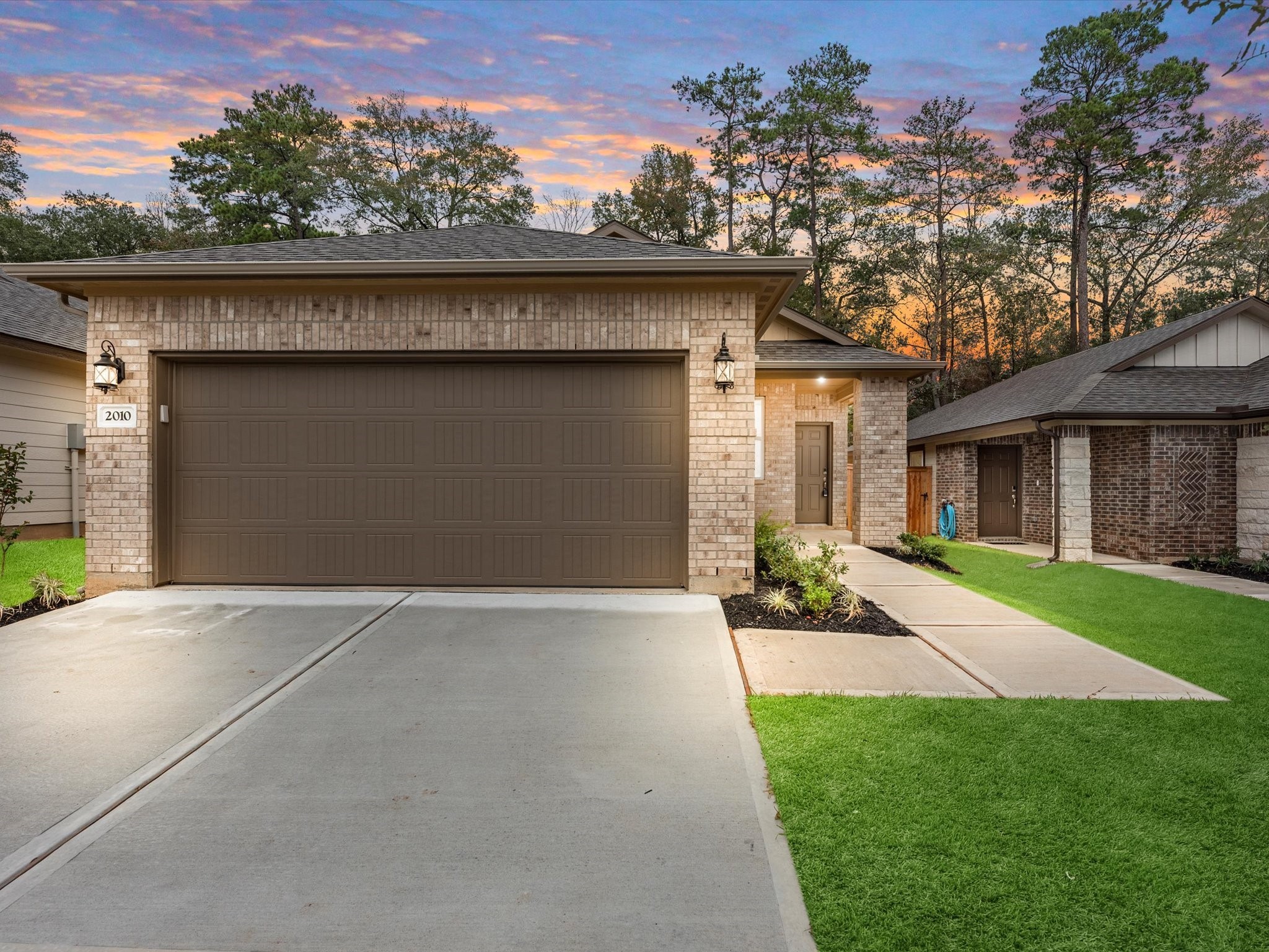 2010 West Darlington Oak Court Conroe, TX 77304 - Photo 3 of 26 front view of a house with a yard